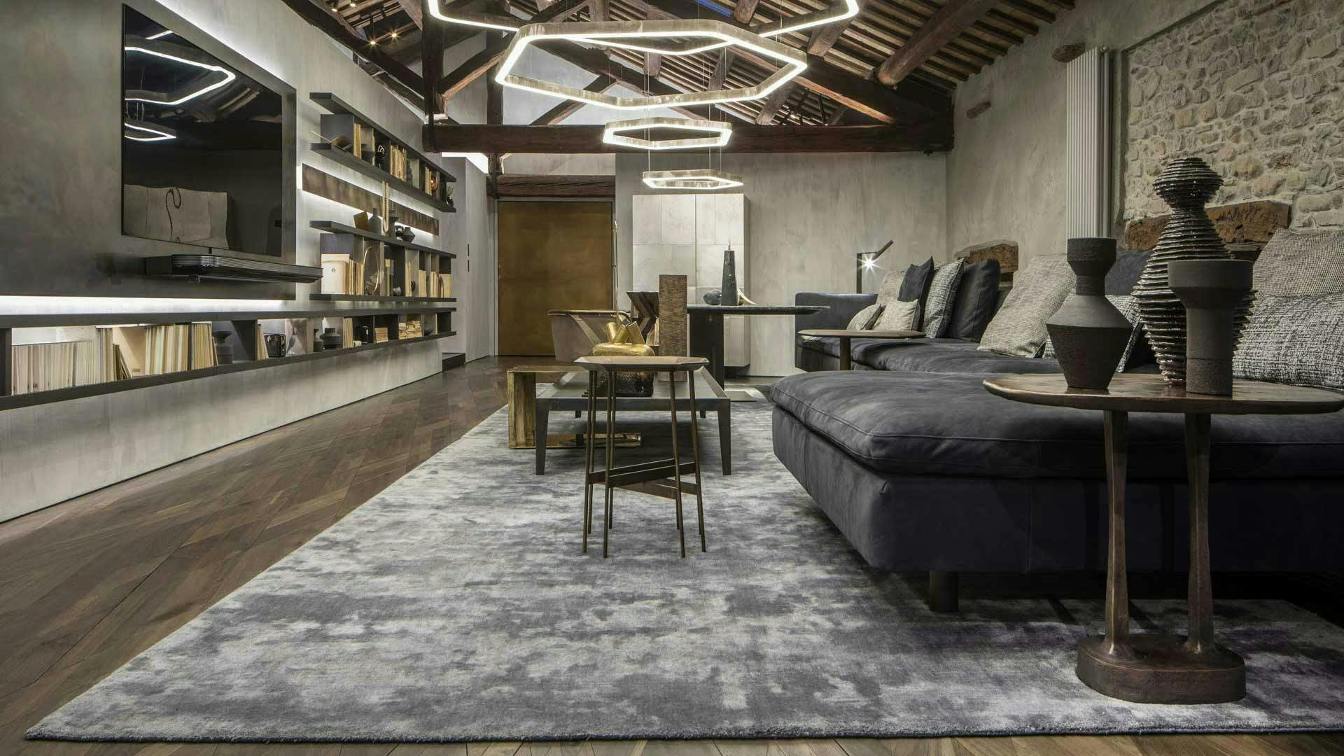 furniture living room room indoors flooring wood floor rug