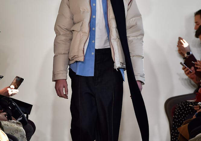 apparel clothing person human coat overcoat