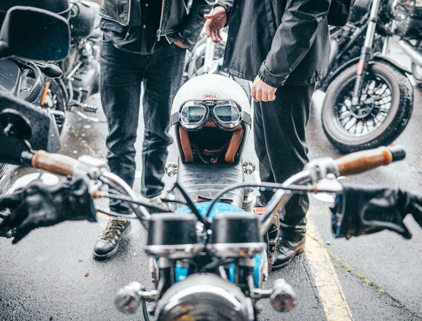 clothing crash helmet helmet machine wheel person motorcycle shoe bicycle sunglasses