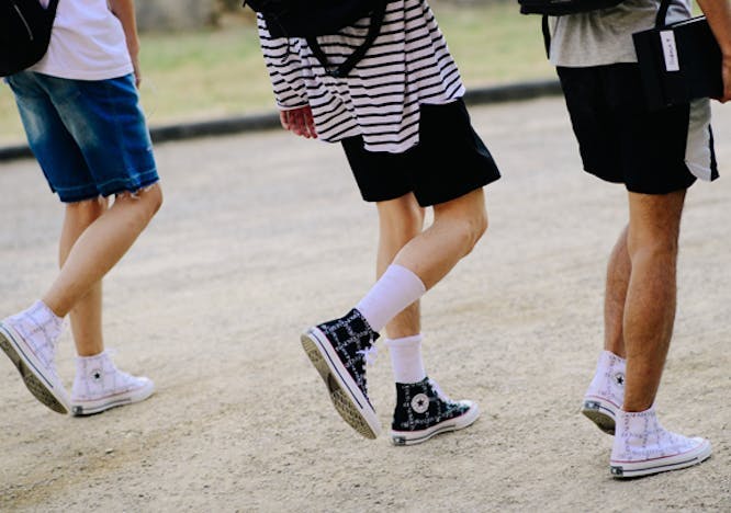 apparel clothing person human shorts footwear shoe running shoe sneaker