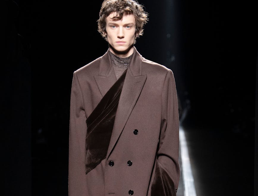 suit overcoat coat apparel clothing human person tuxedo sleeve man