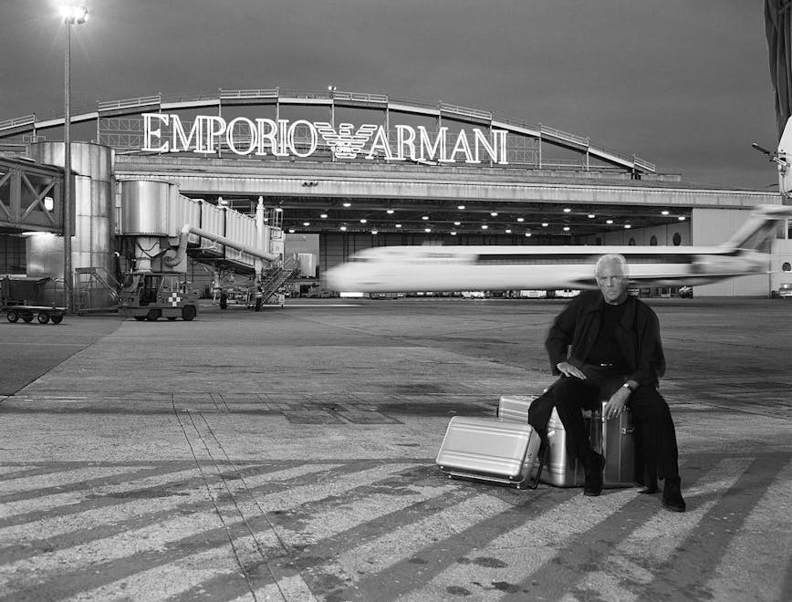 person human building hangar airport aircraft airplane transportation vehicle airfield