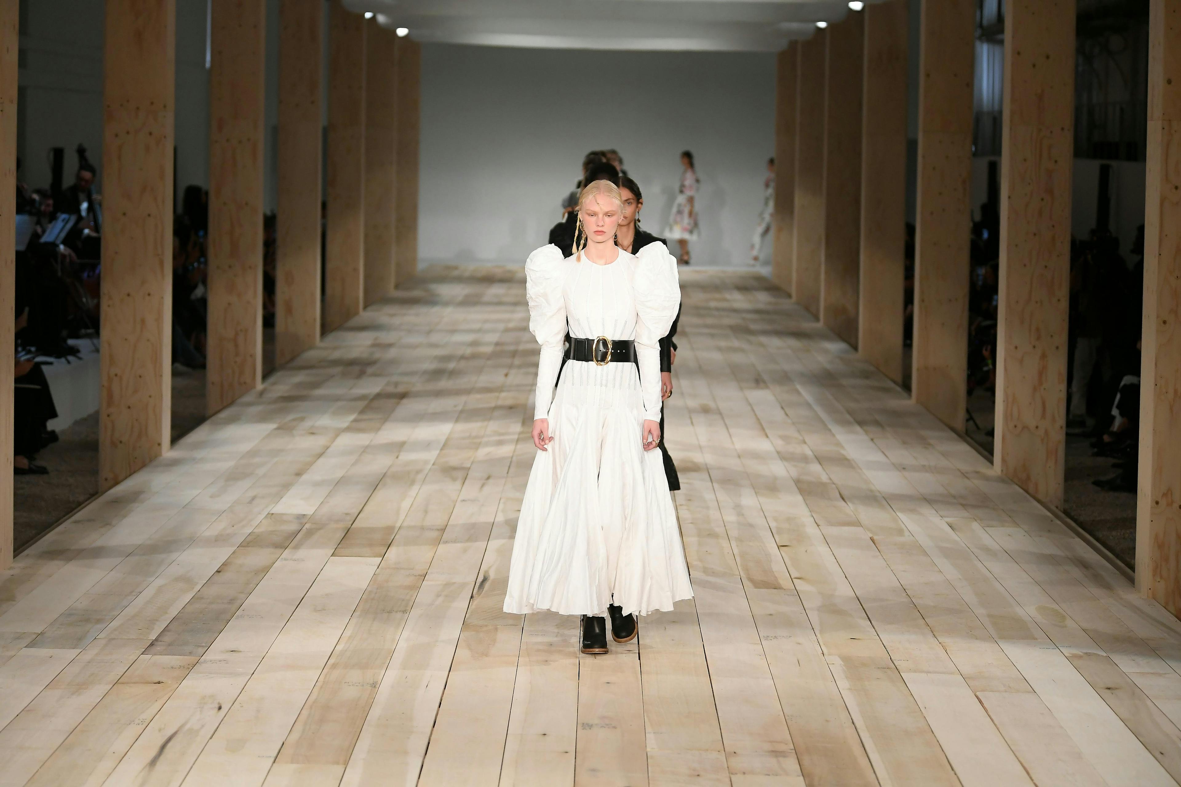 person human flooring floor apparel clothing female corridor sleeve