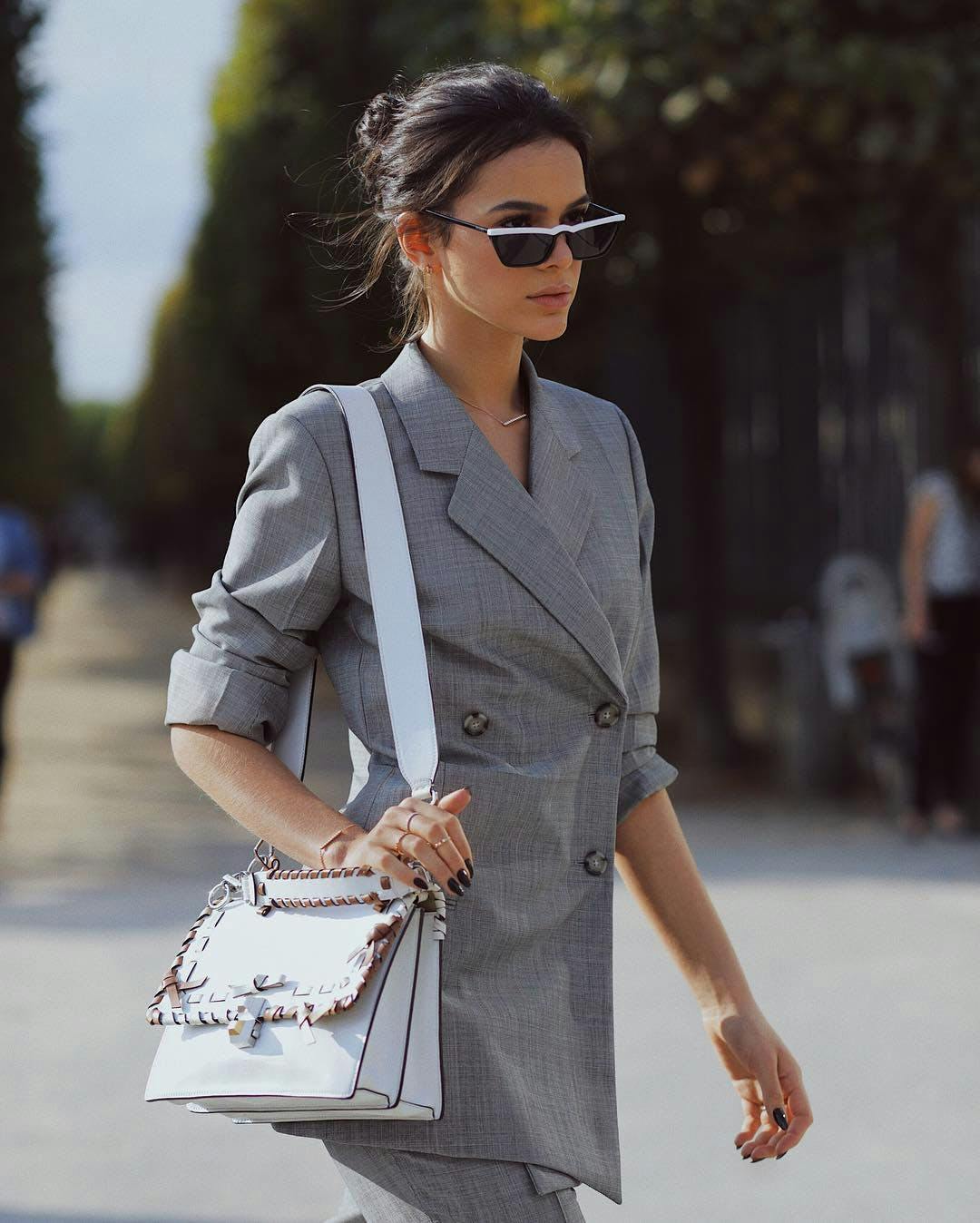human person sleeve clothing accessories sunglasses bag handbag long sleeve purse