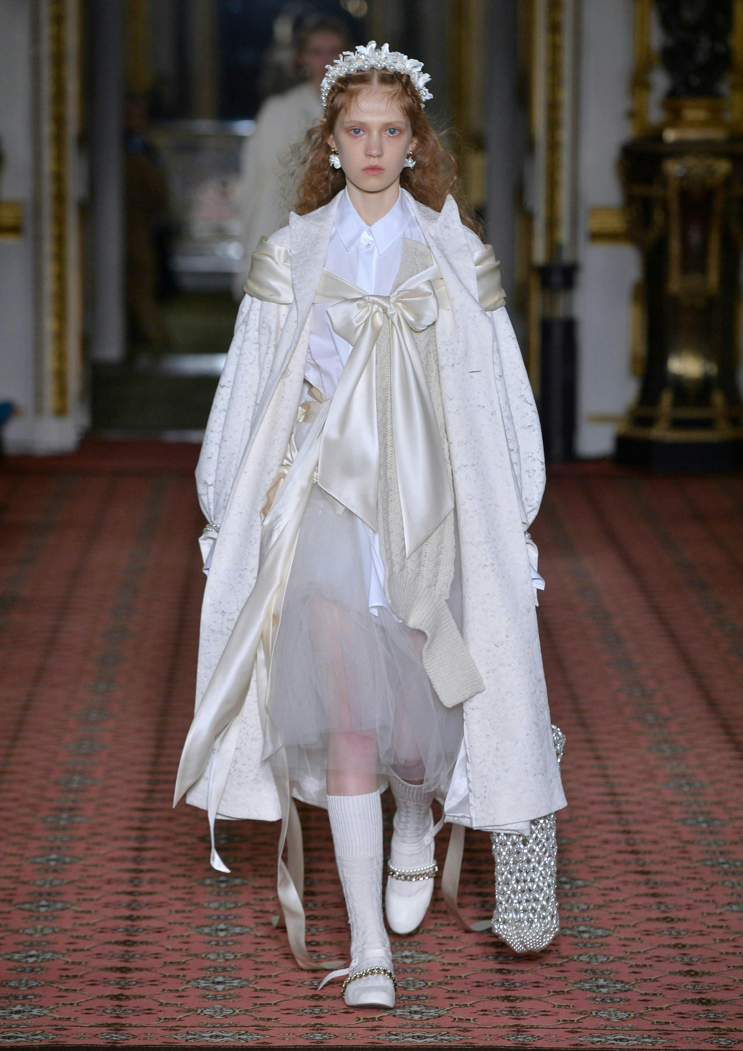 coat clothing apparel sleeve human person long sleeve fashion runway