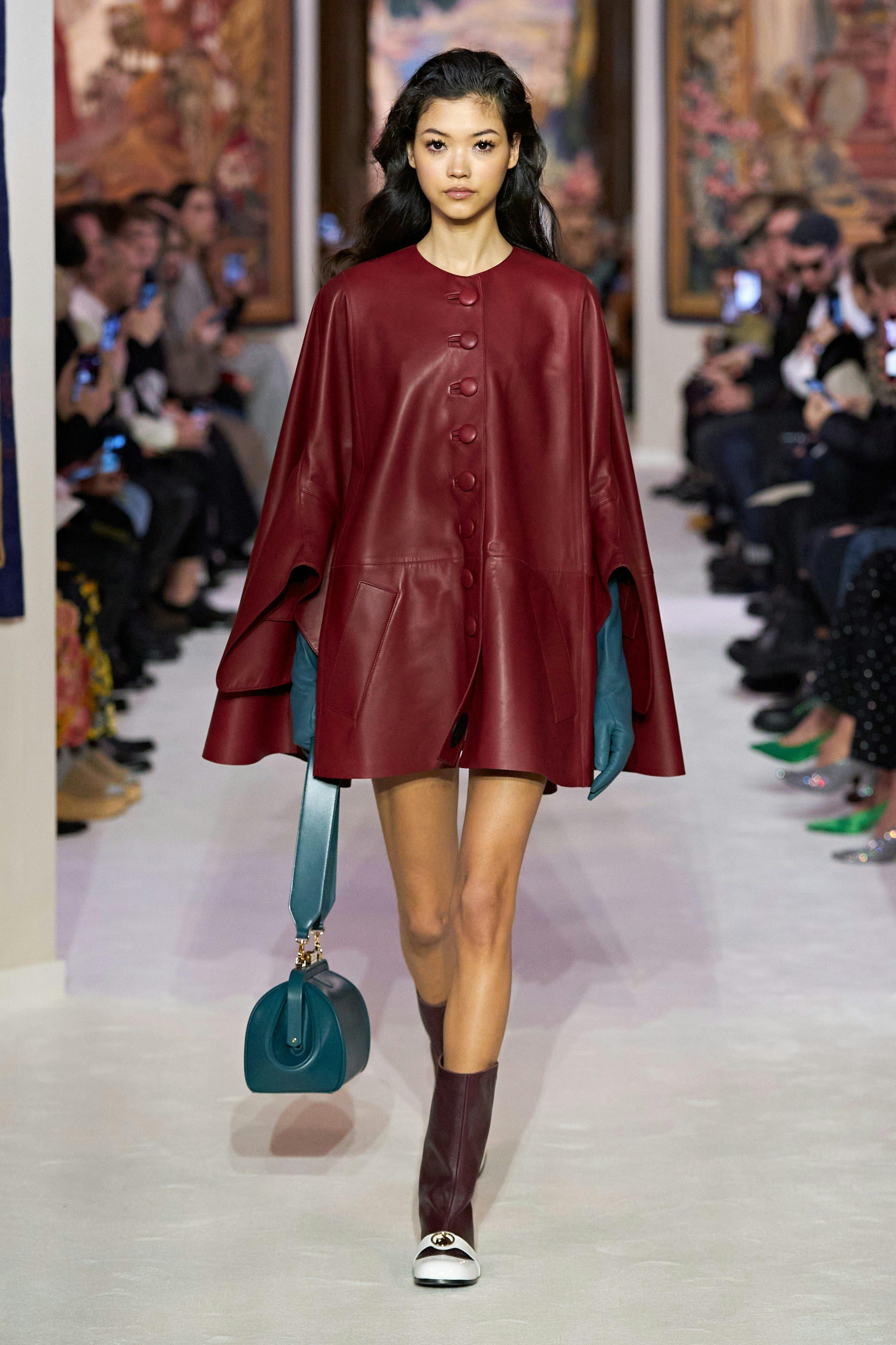 clothing coat apparel person human runway fashion sleeve