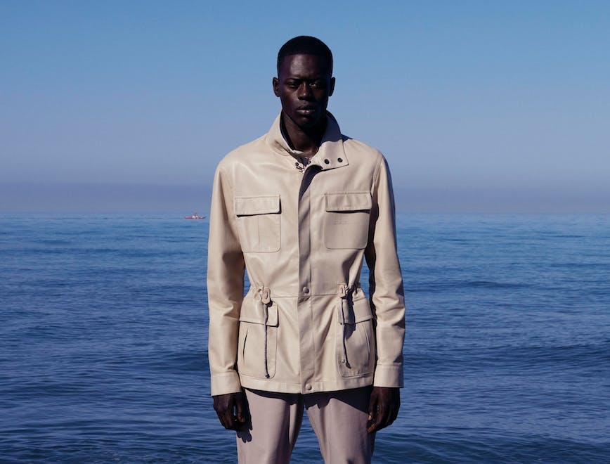 clothing apparel human person coat overcoat sleeve