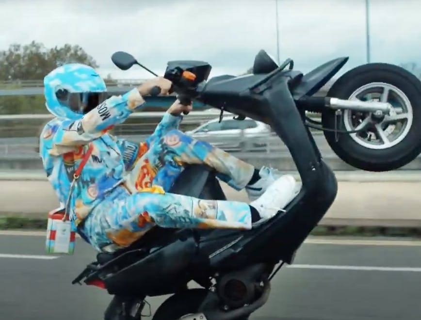 wheel machine transportation vehicle motorcycle apparel clothing helmet moped motor scooter