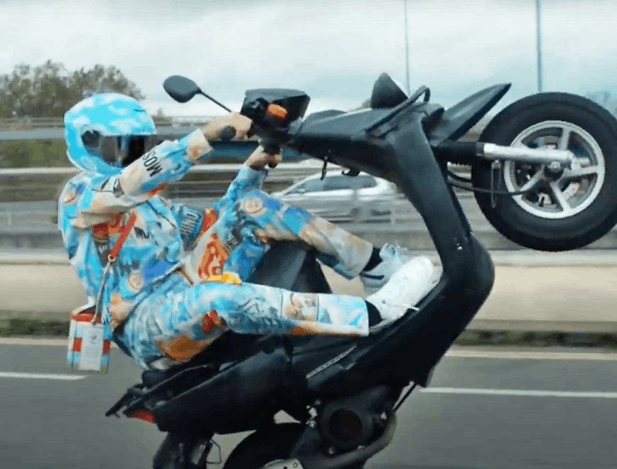 wheel machine transportation vehicle motorcycle apparel clothing helmet moped motor scooter
