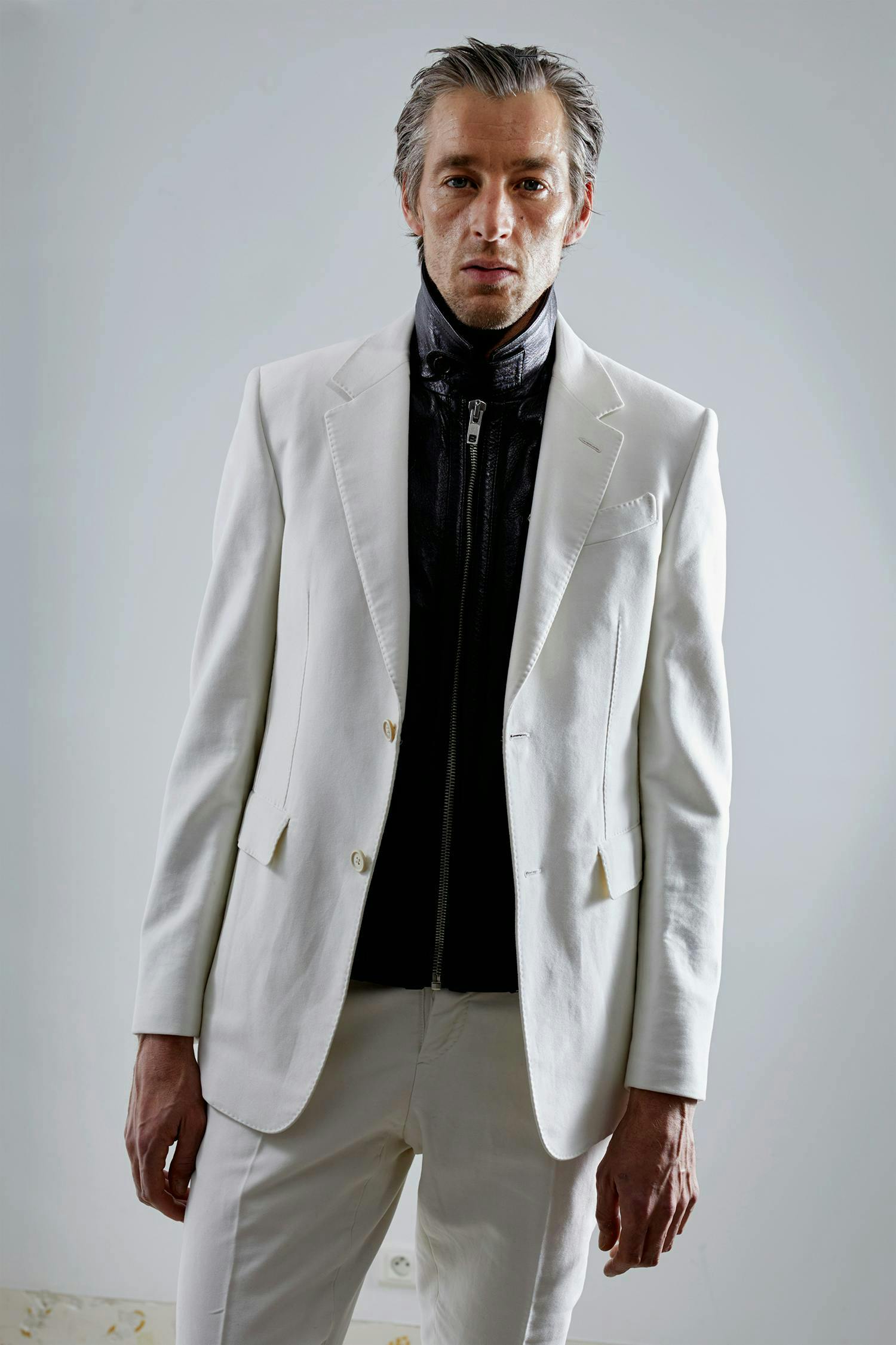 clothing apparel suit coat overcoat blazer jacket tuxedo person shirt