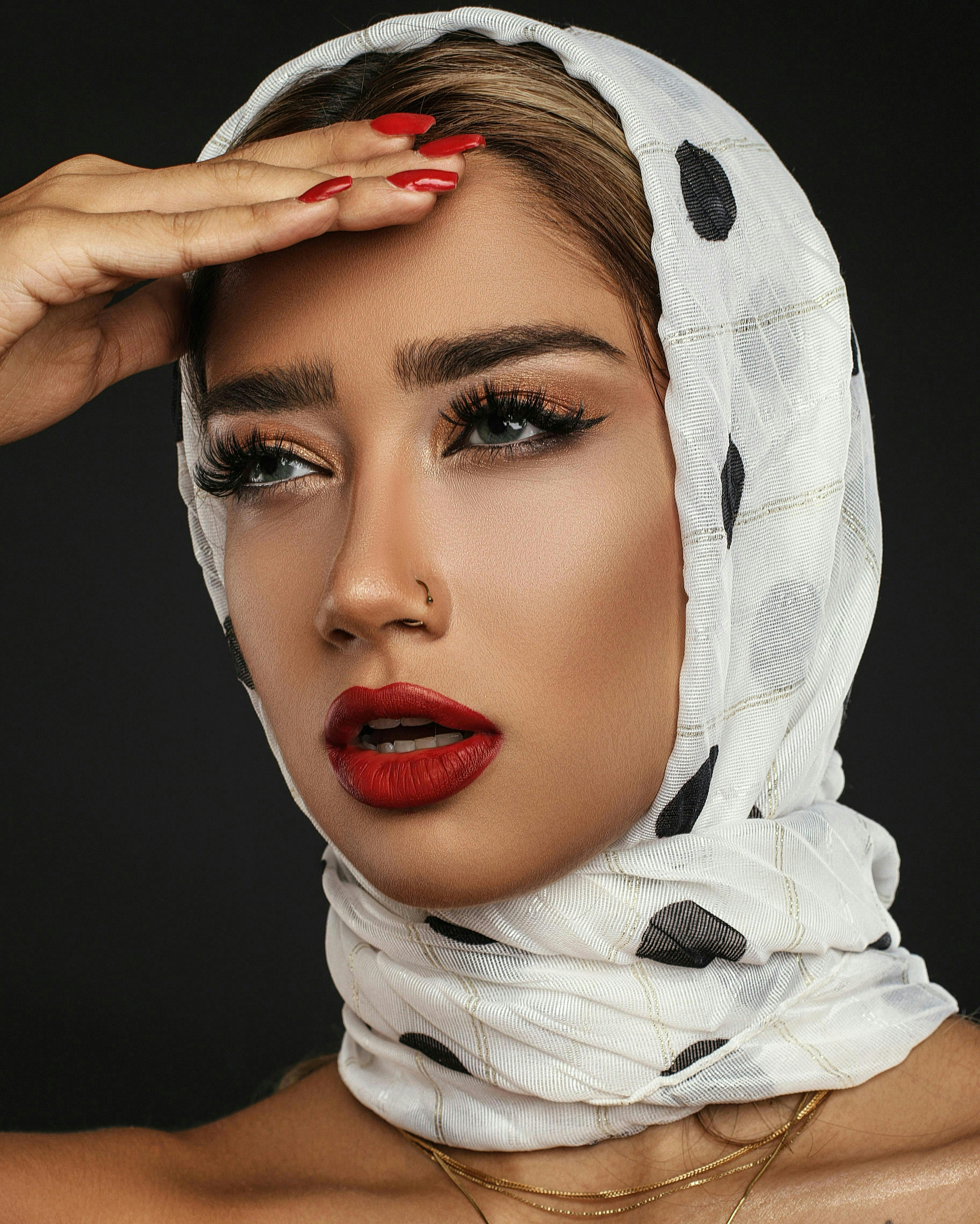 clothing apparel face person human bonnet hat lipstick cosmetics
