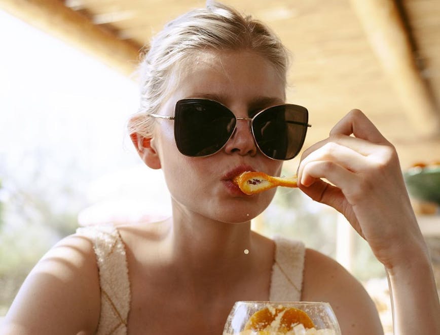 person human sunglasses accessories accessory juice beverage drink orange juice