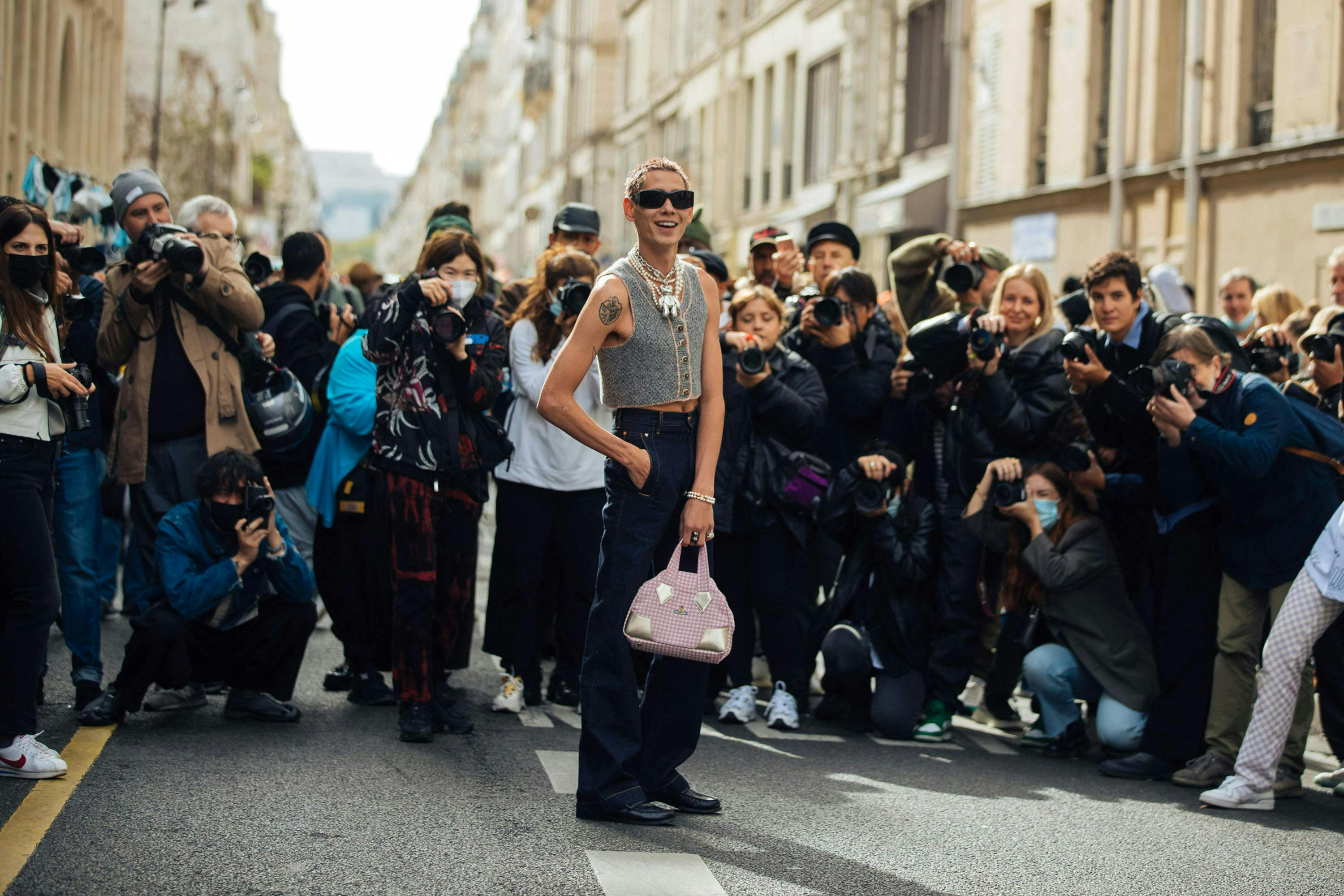 paris paparazzi person human shoe clothing footwear apparel photographer sunglasses accessories