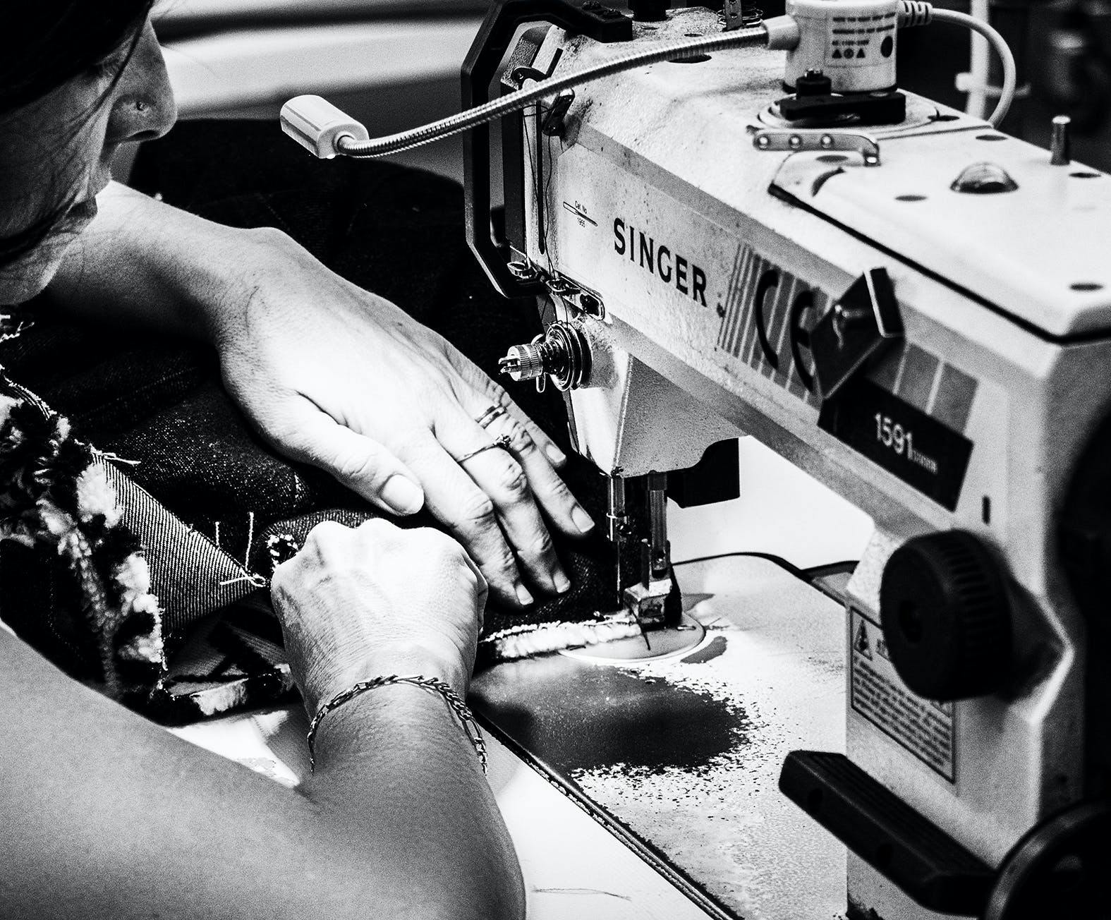 person human machine sewing