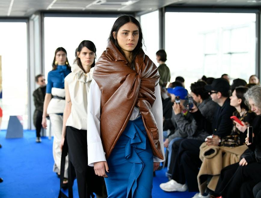 paris coat jacket fashion adult female person woman long sleeve mobile phone shoe