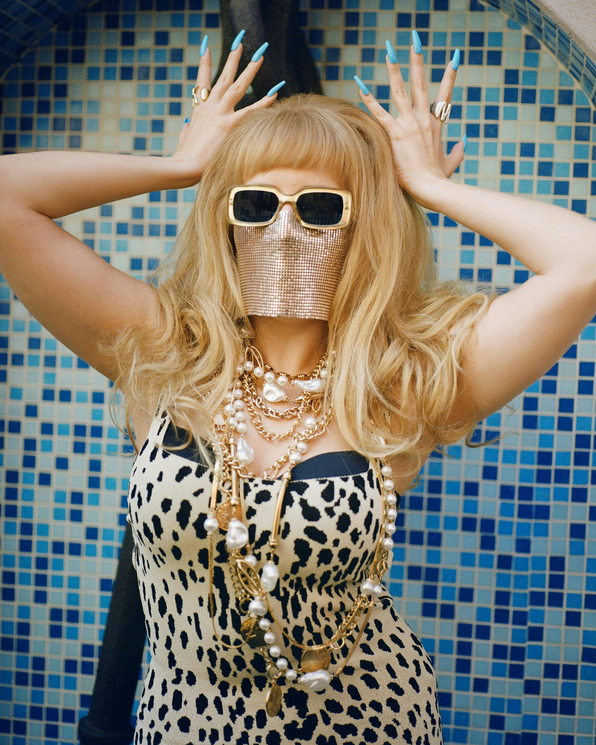 blonde person finger accessories adult female woman head portrait sunglasses