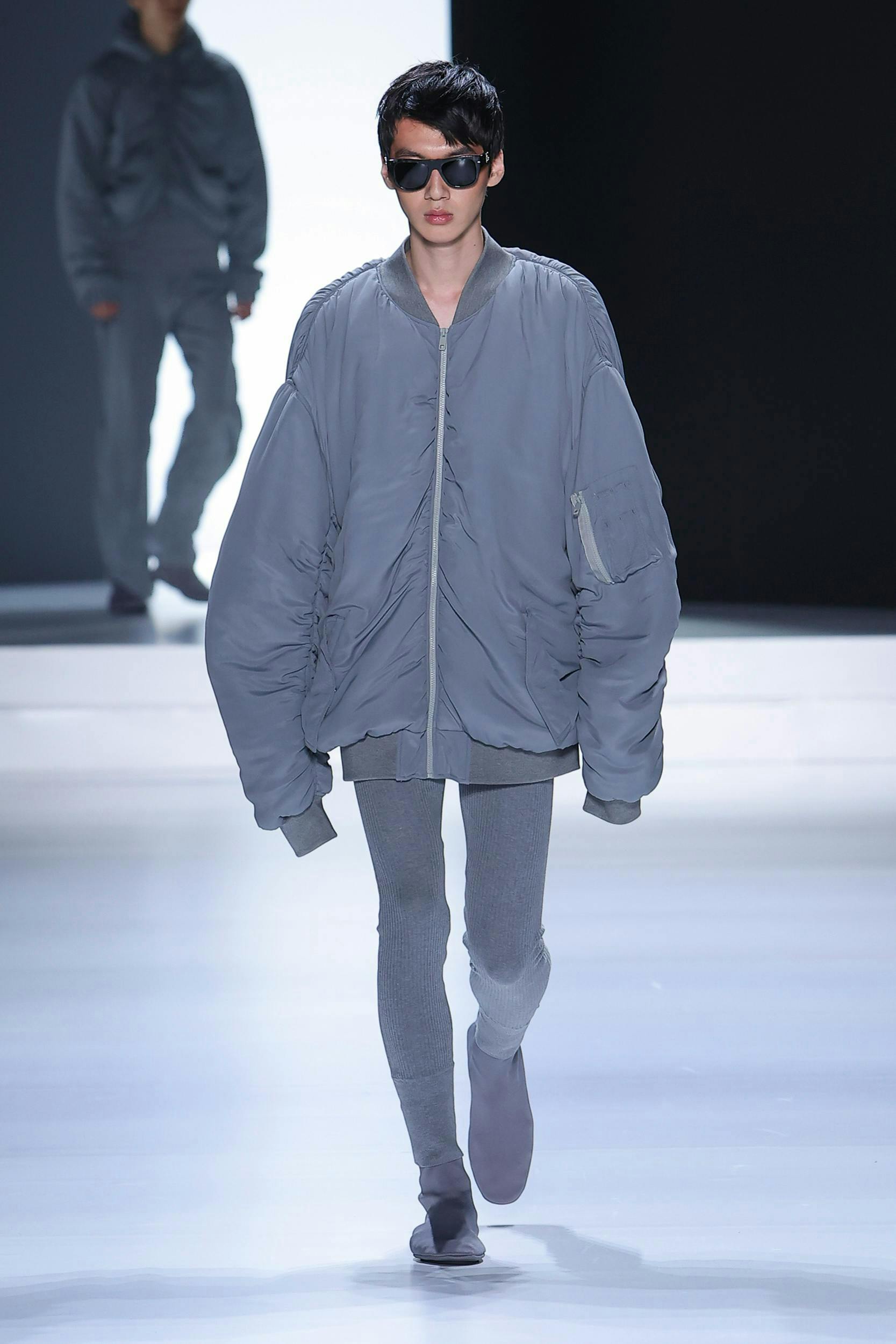 clothing coat fashion long sleeve jacket adult male man person shoe