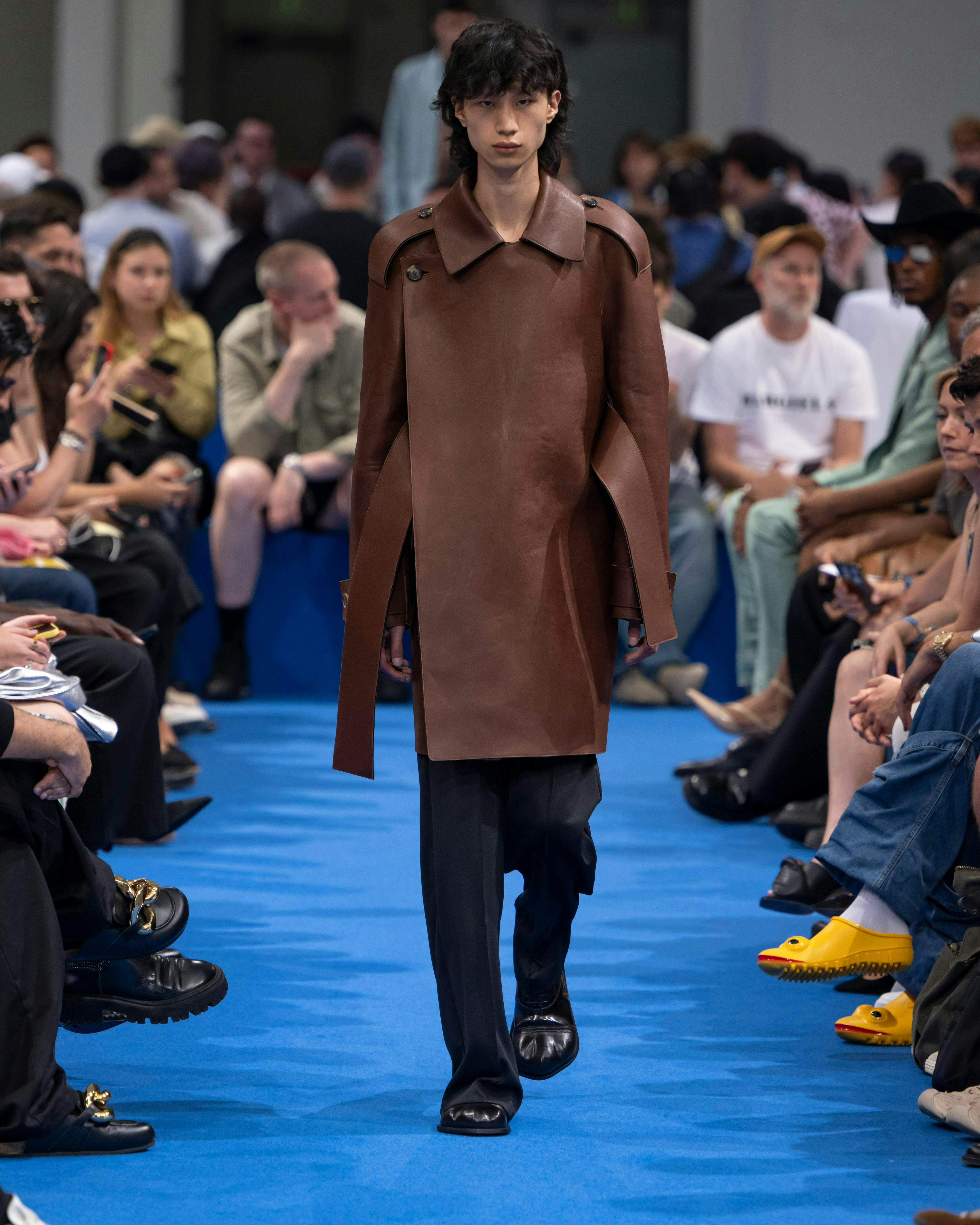coat fashion adult female person woman shoe handbag overcoat glasses