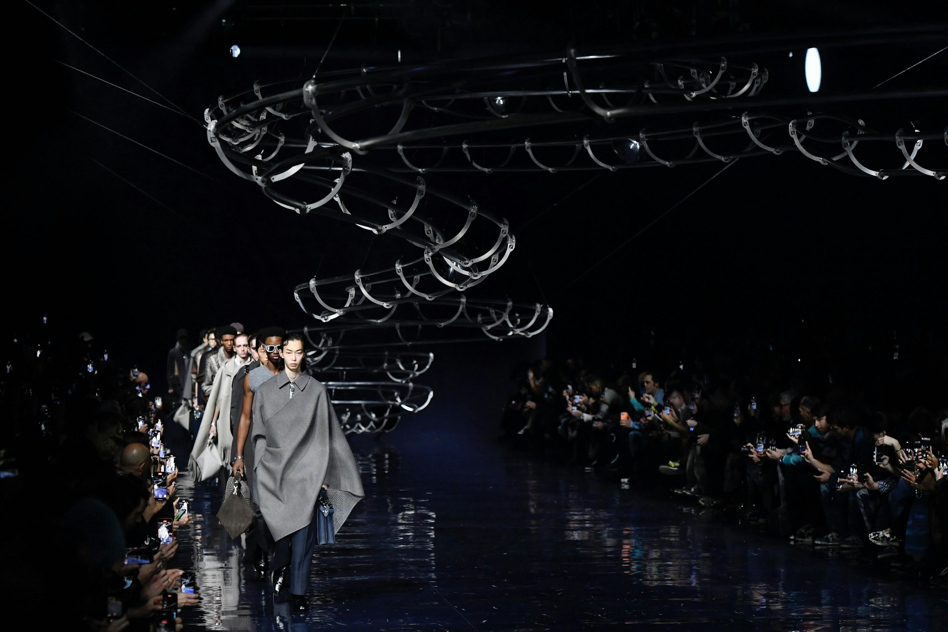 milan coat handbag fashion lighting person people shoe glasses overcoat crowd