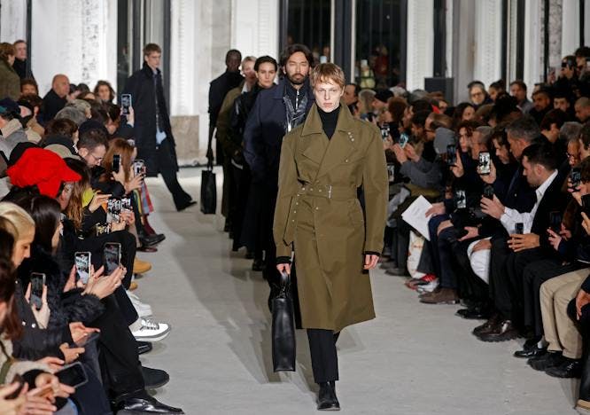 paris coat overcoat handbag adult female person woman male man mobile phone