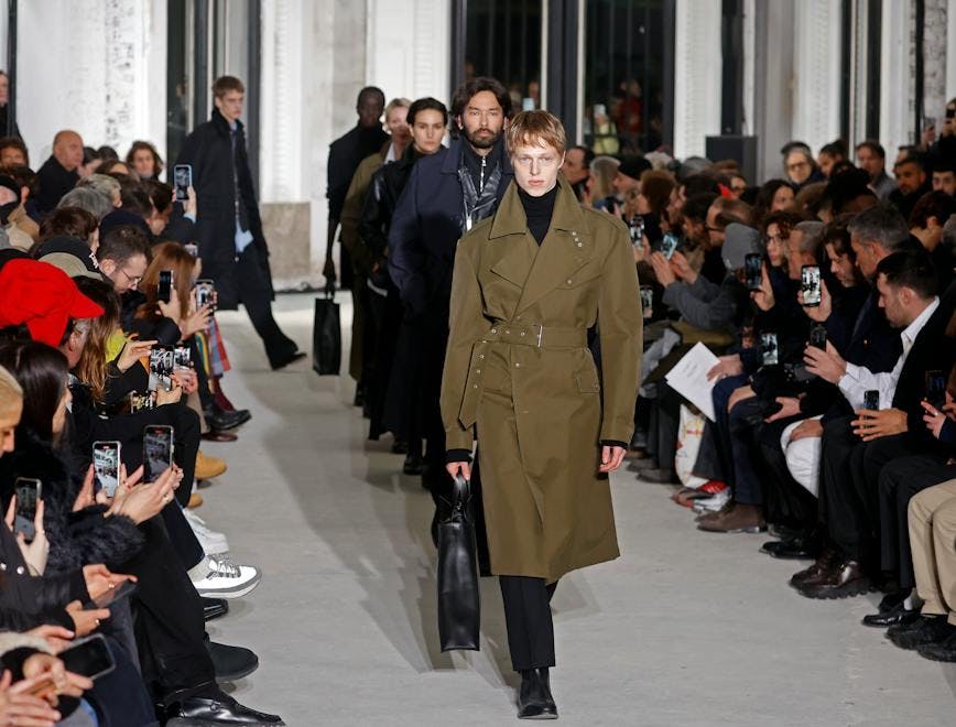 paris coat overcoat handbag adult female person woman male man mobile phone