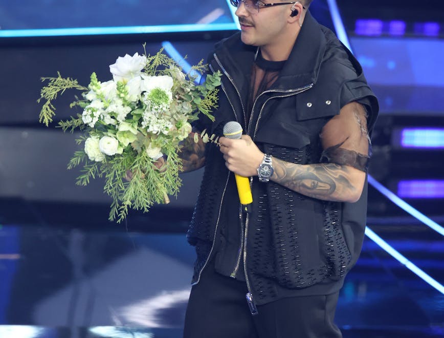 sanremo flower flower arrangement flower bouquet microphone person tattoo solo performance adult male man