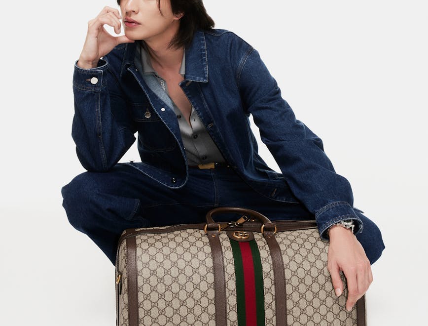 coat jacket adult female person woman bag handbag baggage blazer