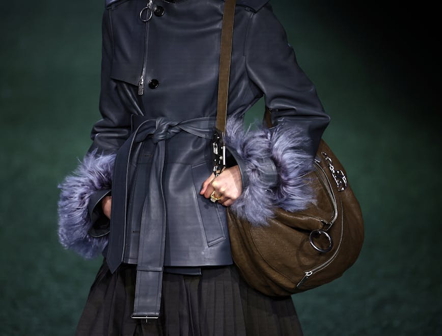 horizontal fashion arts culture and entertainment london clothing coat accessories bag handbag purse overcoat jacket finger handcuffs