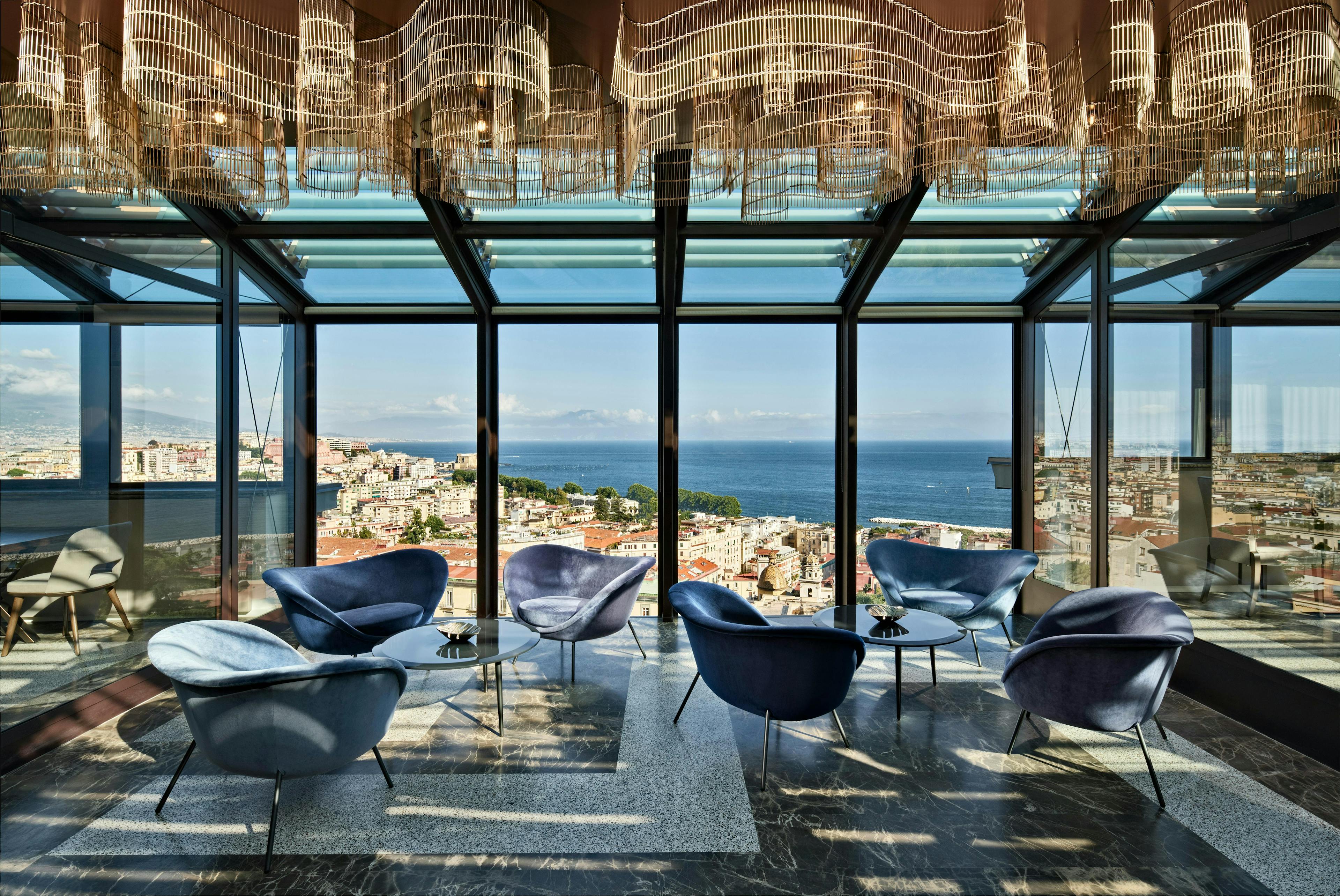 curio britannique hilton pastrovicchio architecture building furniture indoors lounge chair desk table